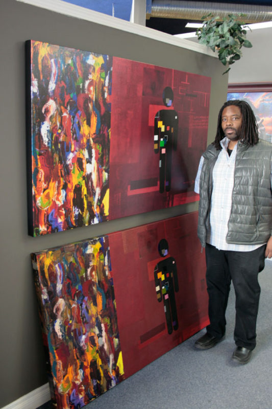 Artist Darren Jordan with Vessel and art reproduction on canvas