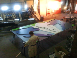 Nick using the large multi-purpose space pre-assembling the mural for Grandin 