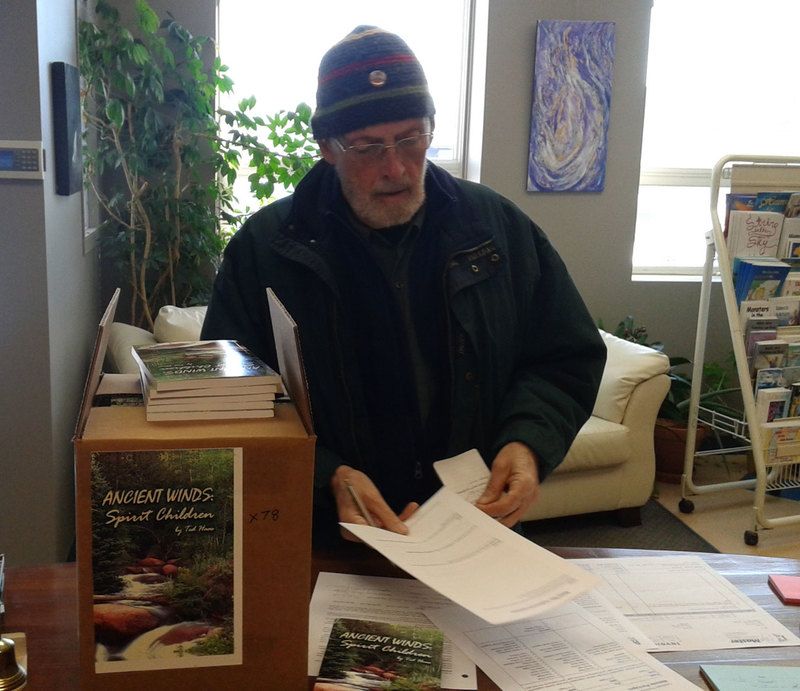 Ted Haas of Blue Turtle books with his novel, Ancient Winds: Spirit Children.